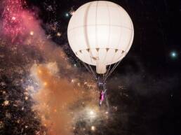 Acrobatic balloon with acrobat and fireworks